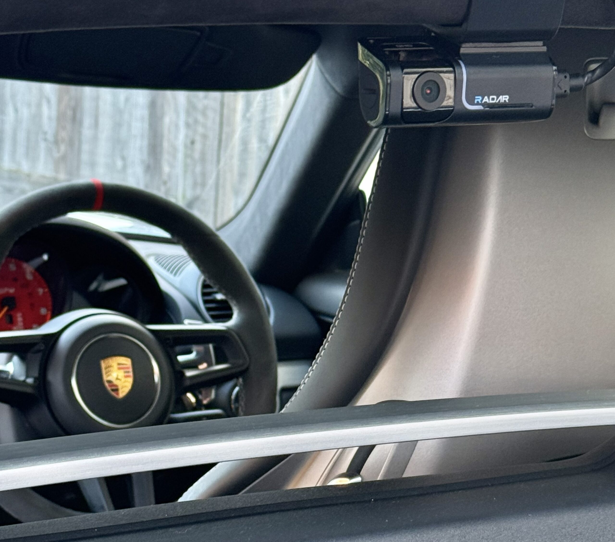 dash-cam-installation-hidden-wiring-porsche-interior Professional dash cam installation with hidden wiring inside a Porsche vehicle interior